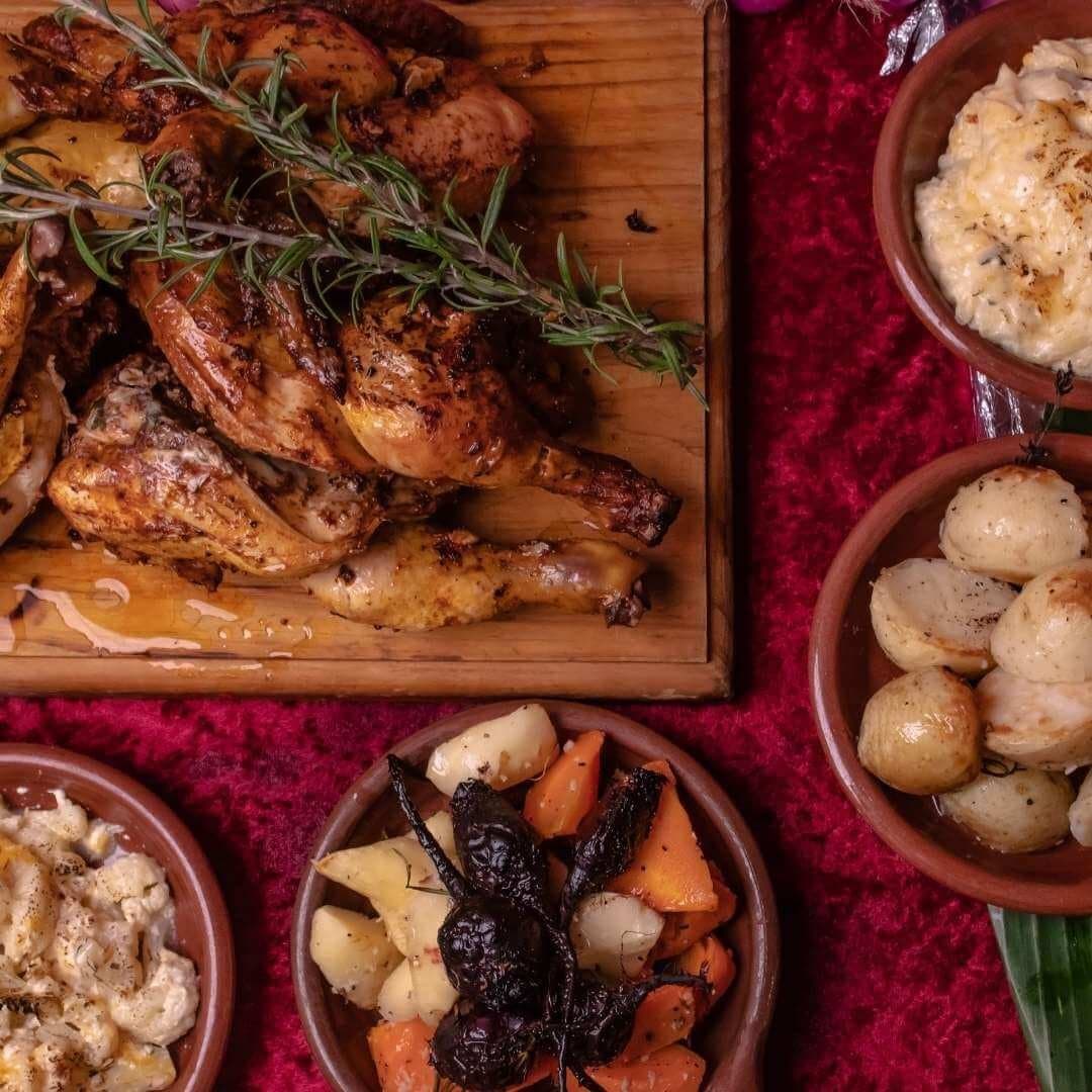 Roast chicken with roast potatoes and sides